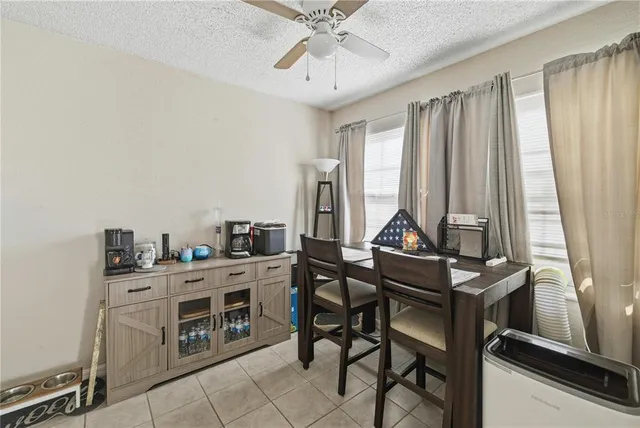 a room with a table and chairs