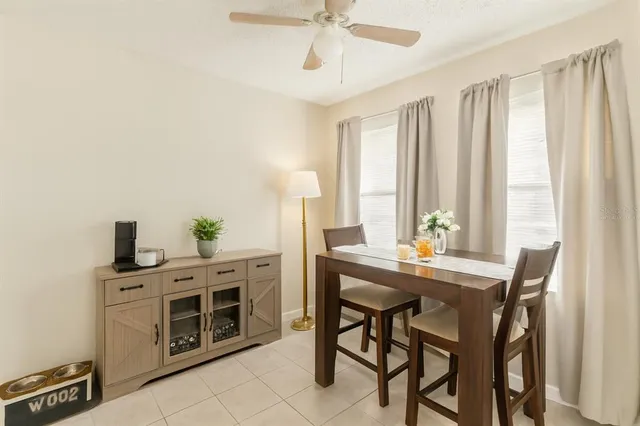 a view of a dining room with furniture and window