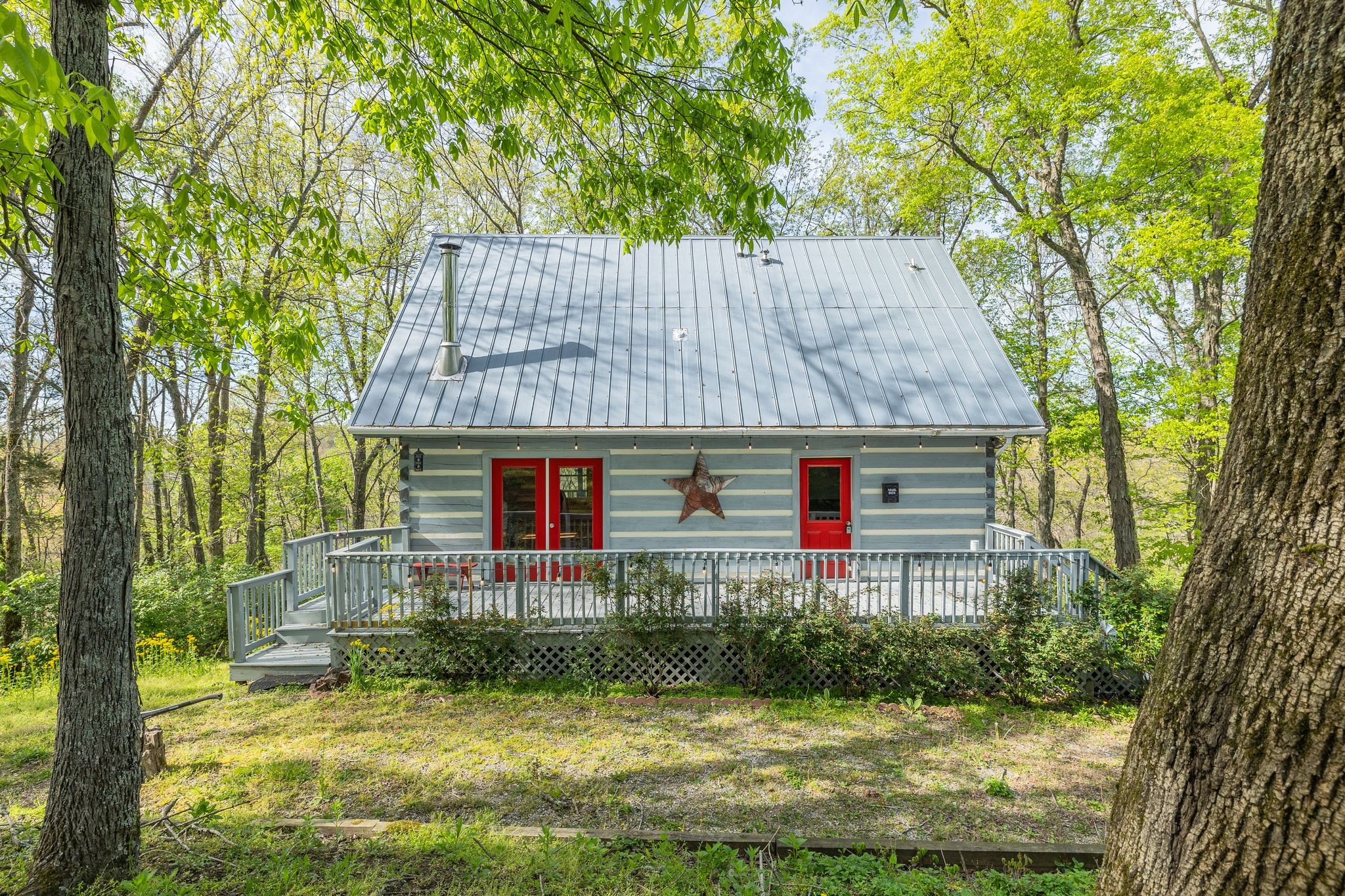 a front view of house with yard and green space