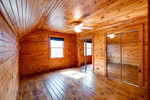a bathroom with a toilet and a shower curtain