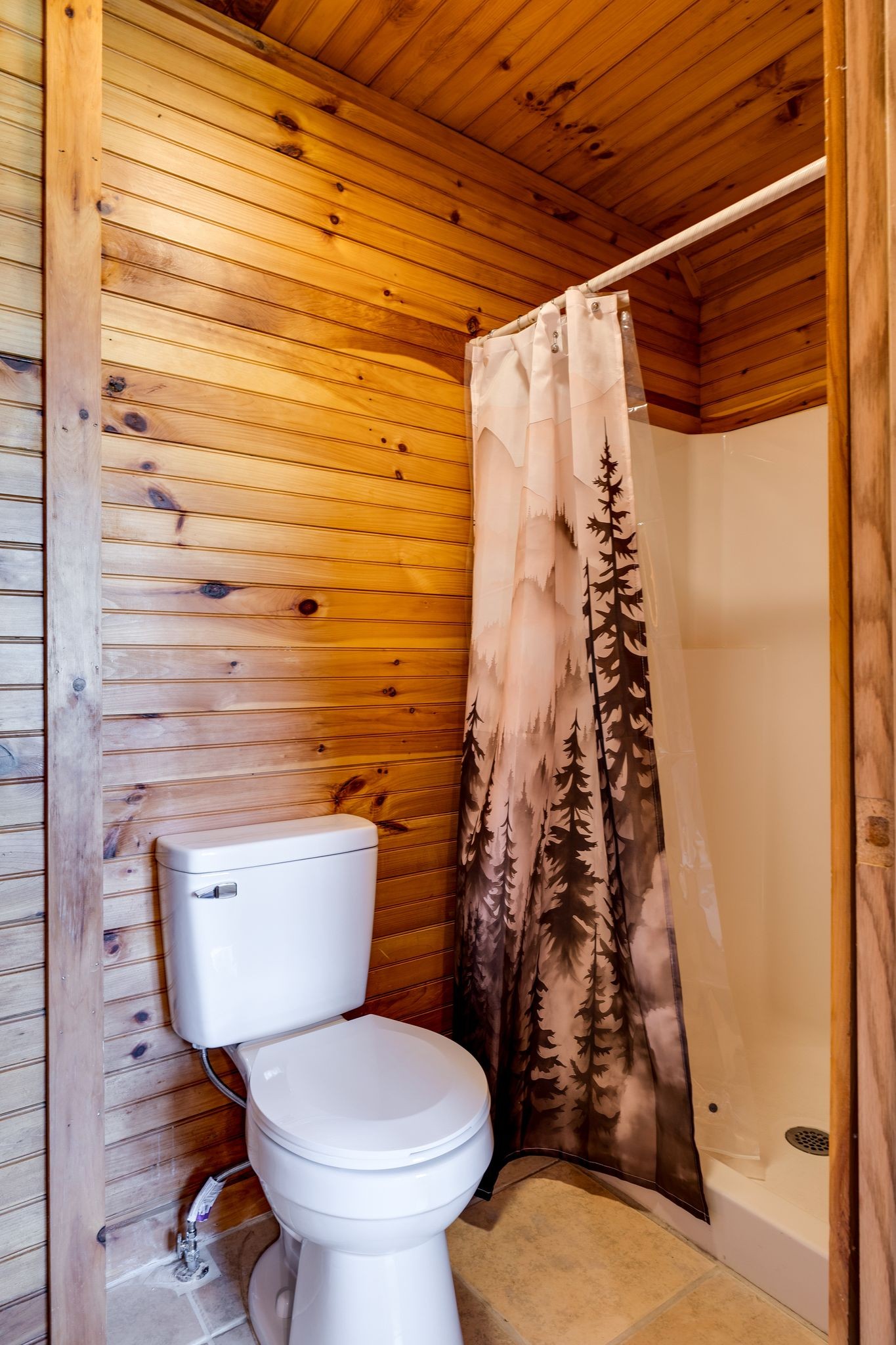 1707 Sugar Ridge Road Spring Hill, TN 37174 - Photo 17 of 38 a bathroom with a toilet and a shower curtain