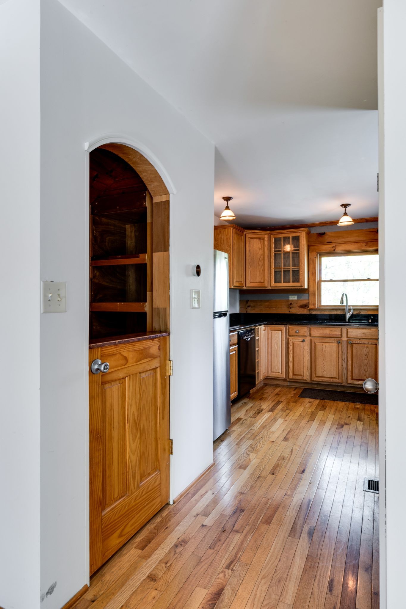 1707 Sugar Ridge Road Spring Hill, TN 37174 - Photo 19 of 38 a view of wooden floor and windows in a kitchen