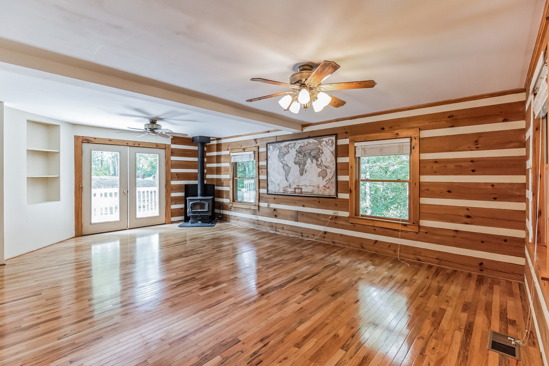 1707 Sugar Ridge Road Spring Hill, TN 37174 - Photo 3 of 5 a view of an empty room with wooden floor and a window
