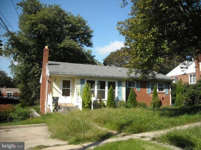 11810 Indigo Road Silver Spring, MD 20906 - Photo 2 of 7 a front view of a house with a yard