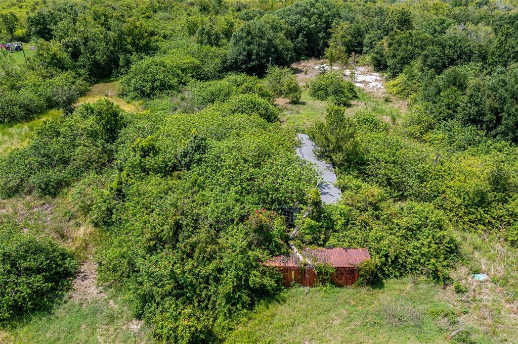10800 Bill Tucker Road Wimauma, FL 33598 - Photo 8 of 9 an aerial view of a house with a yard