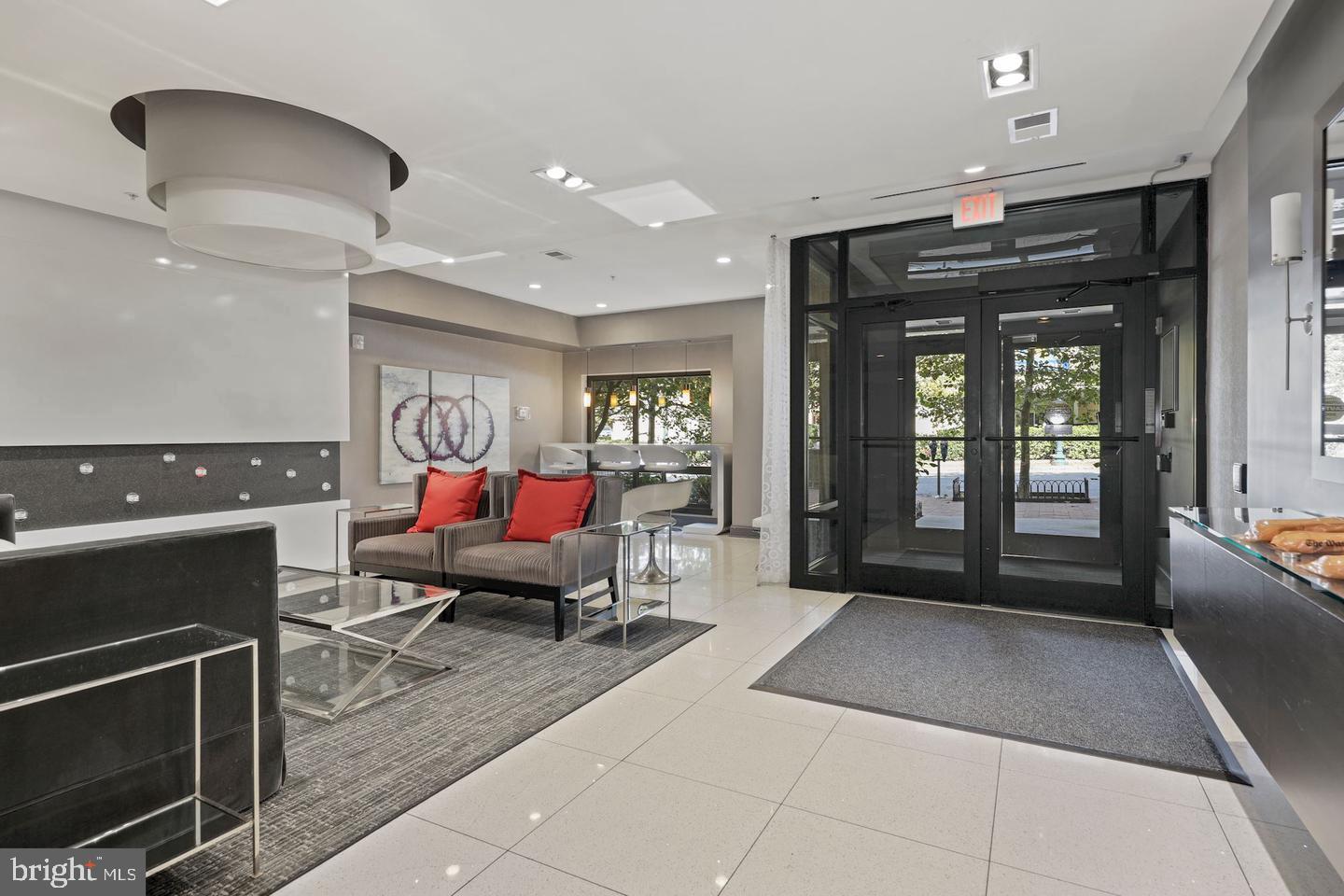 8005 13th Street, Unit 201 Silver Spring, MD 20910 - Photo 24 of 28 a living room with furniture and a fireplace