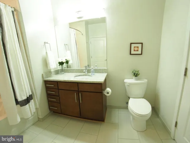 a bathroom with a shower and a glass door