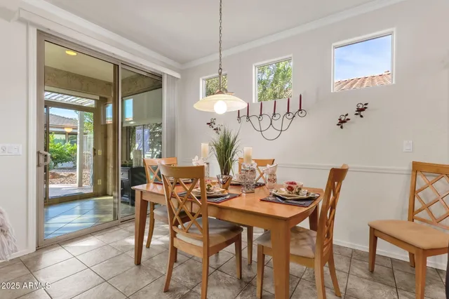 a dining room with furniture and wooden floor