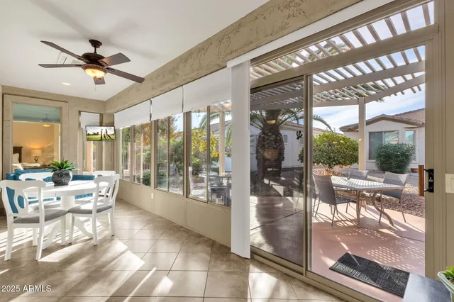 a view of a dining room with furniture wooden floor and a chandelier