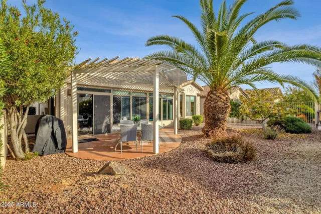 a view of a house with backyard and porch