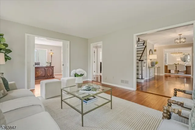 a living room with furniture and a table