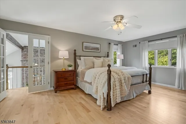 a bed room with a bed and a chandelier