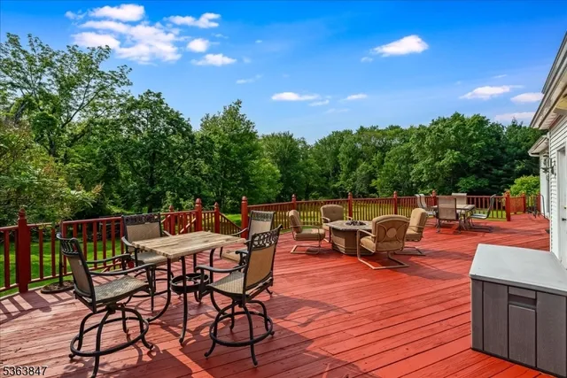 a patio with tables and chairs