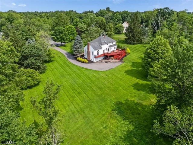a view of a small house with a park