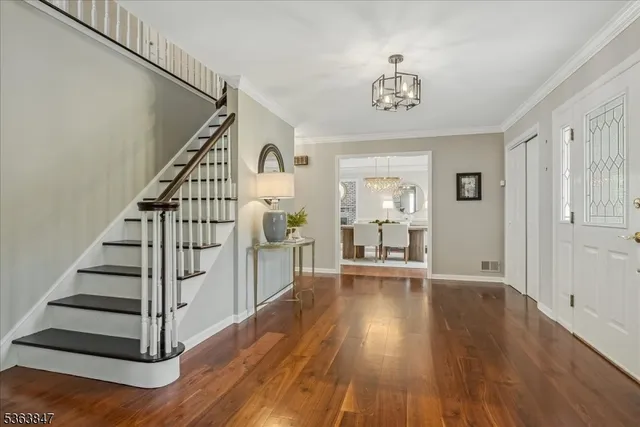 a view of an entryway with wooden floor
