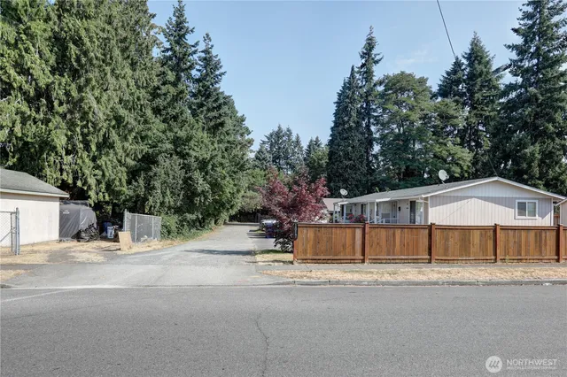 a view of a house with a yard and garage