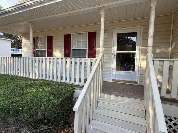a view of a house with a window and wooden floor