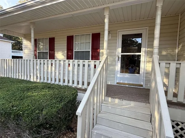 a view of a house with a window and wooden floor