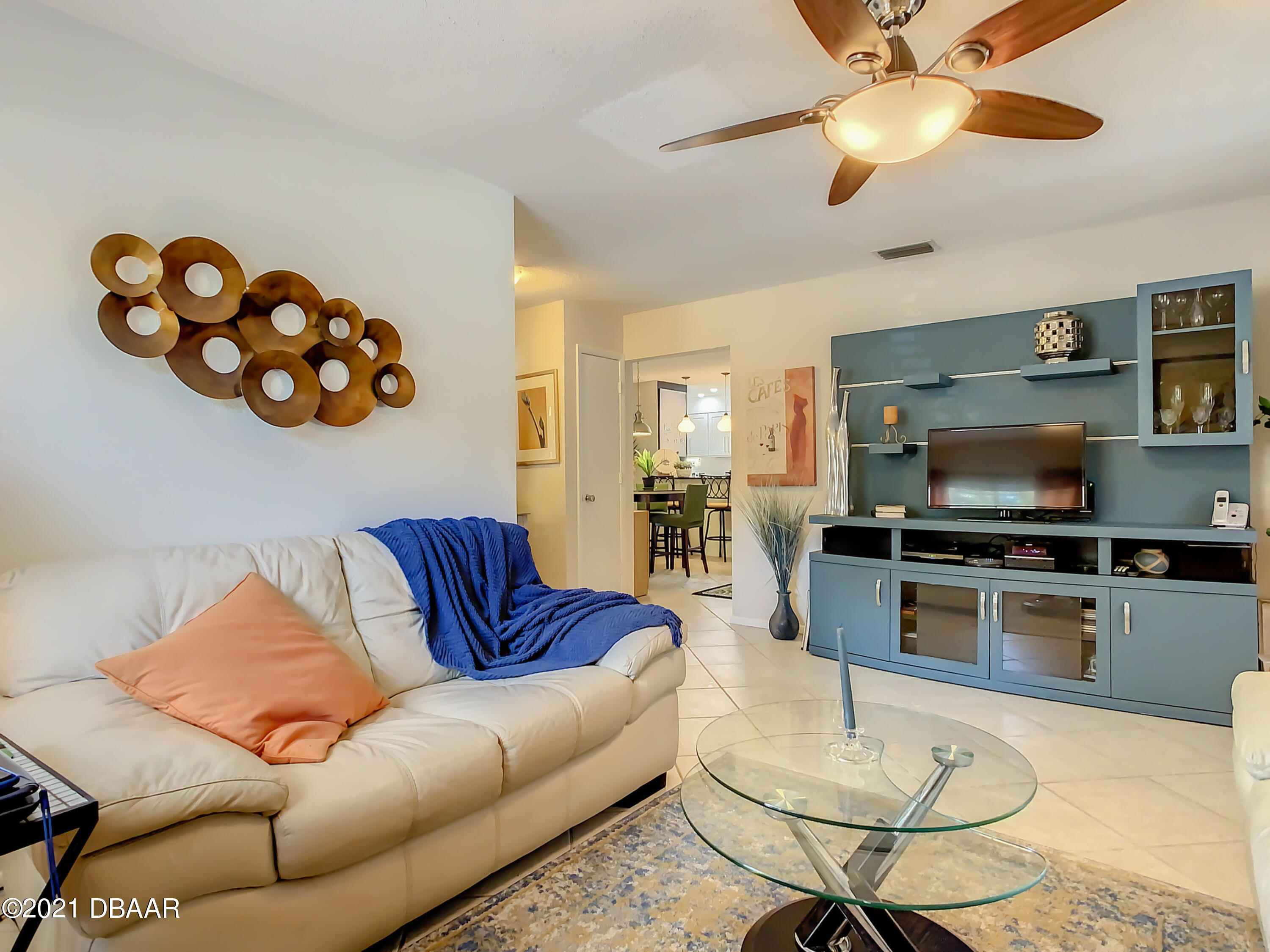 127 Cypress Pond Road Port Orange, FL 32128 - Photo 12 of 52 a living room with furniture kitchen view and a flat screen tv