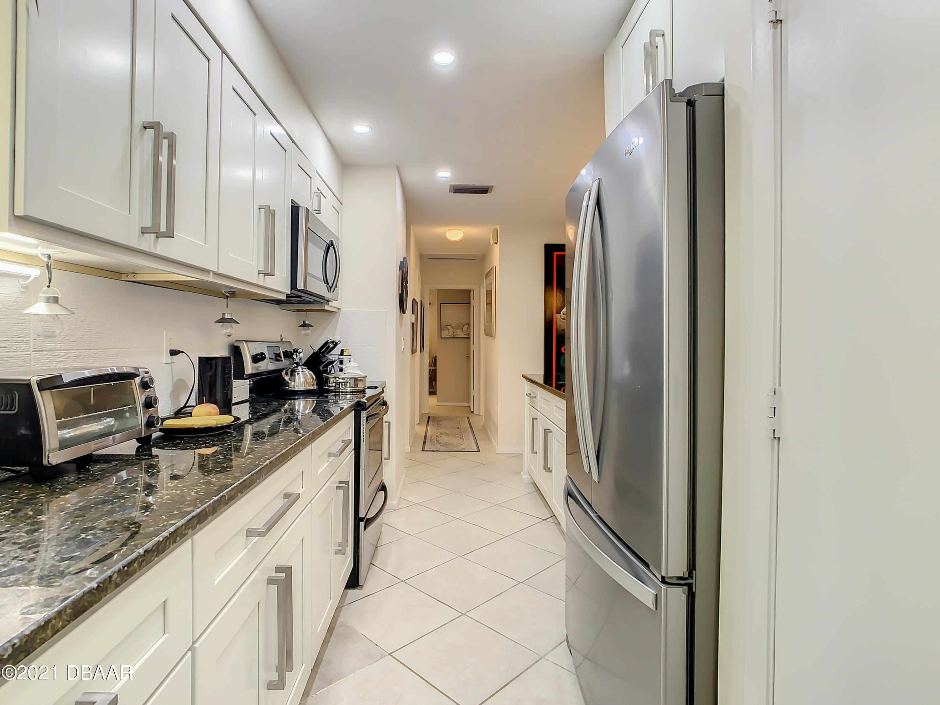 127 Cypress Pond Road Port Orange, FL 32128 - Photo 15 of 52 a kitchen with stainless steel appliances granite countertop a refrigerator and a sink