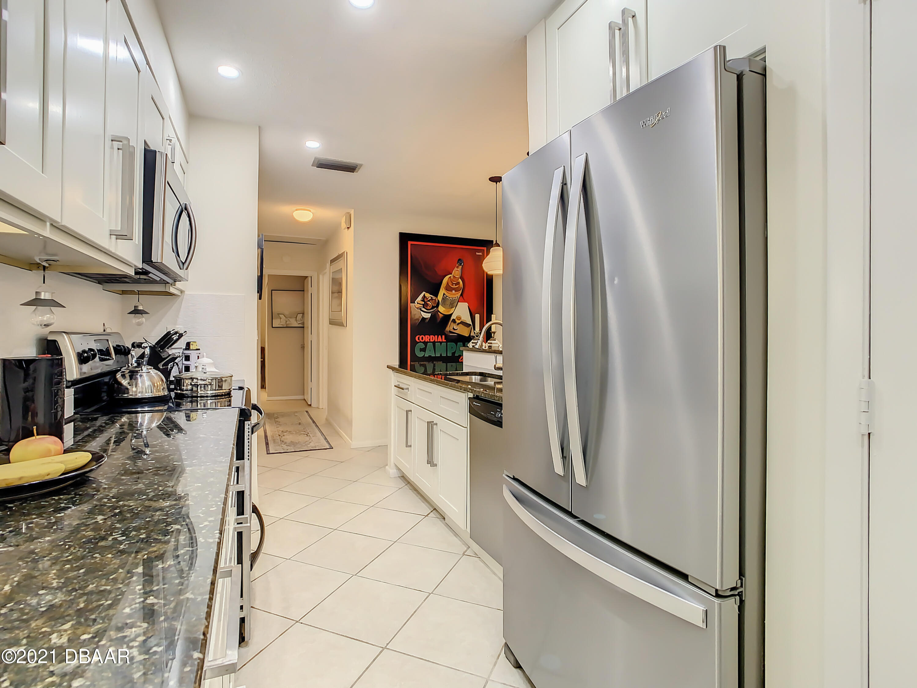 127 Cypress Pond Road Port Orange, FL 32128 - Photo 17 of 52 a kitchen with stainless steel appliances granite countertop a refrigerator and a sink