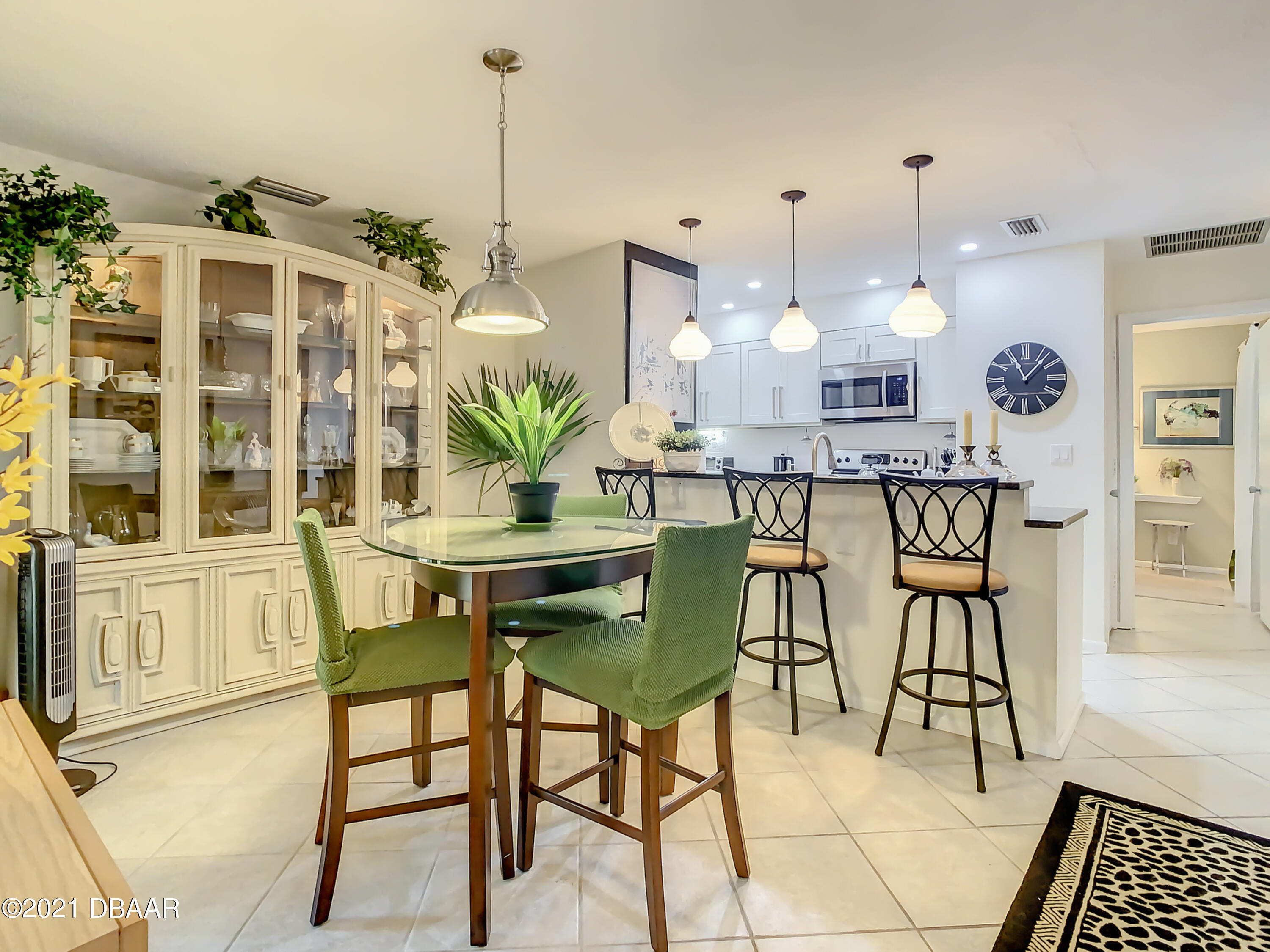 127 Cypress Pond Road Port Orange, FL 32128 - Photo 19 of 52 a kitchen with a table and chairs in it