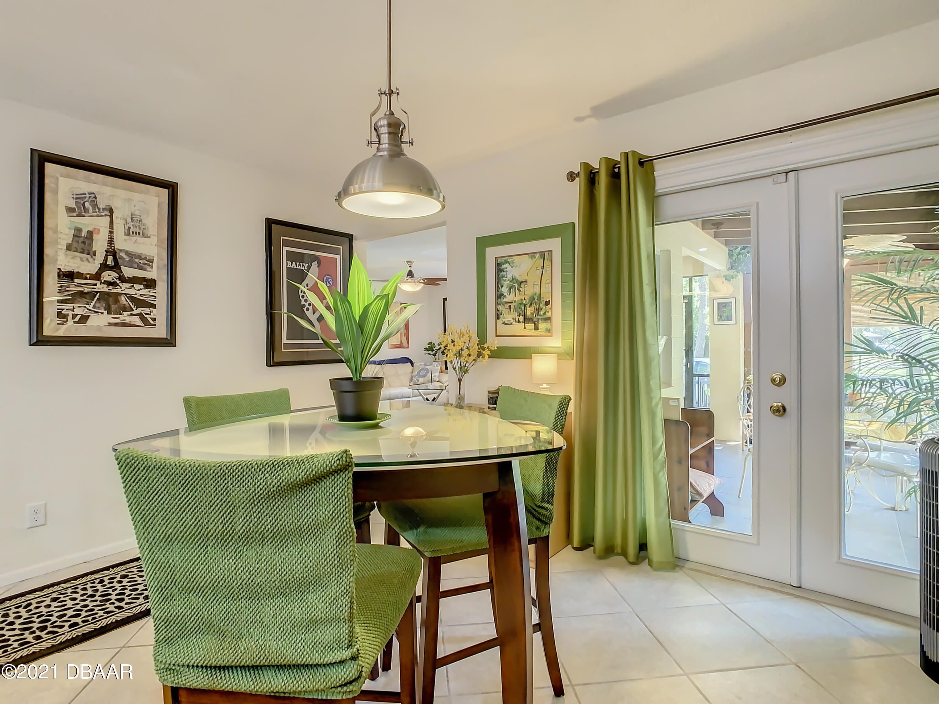 127 Cypress Pond Road Port Orange, FL 32128 - Photo 20 of 52 a view of a dining room with furniture window and wooden floor