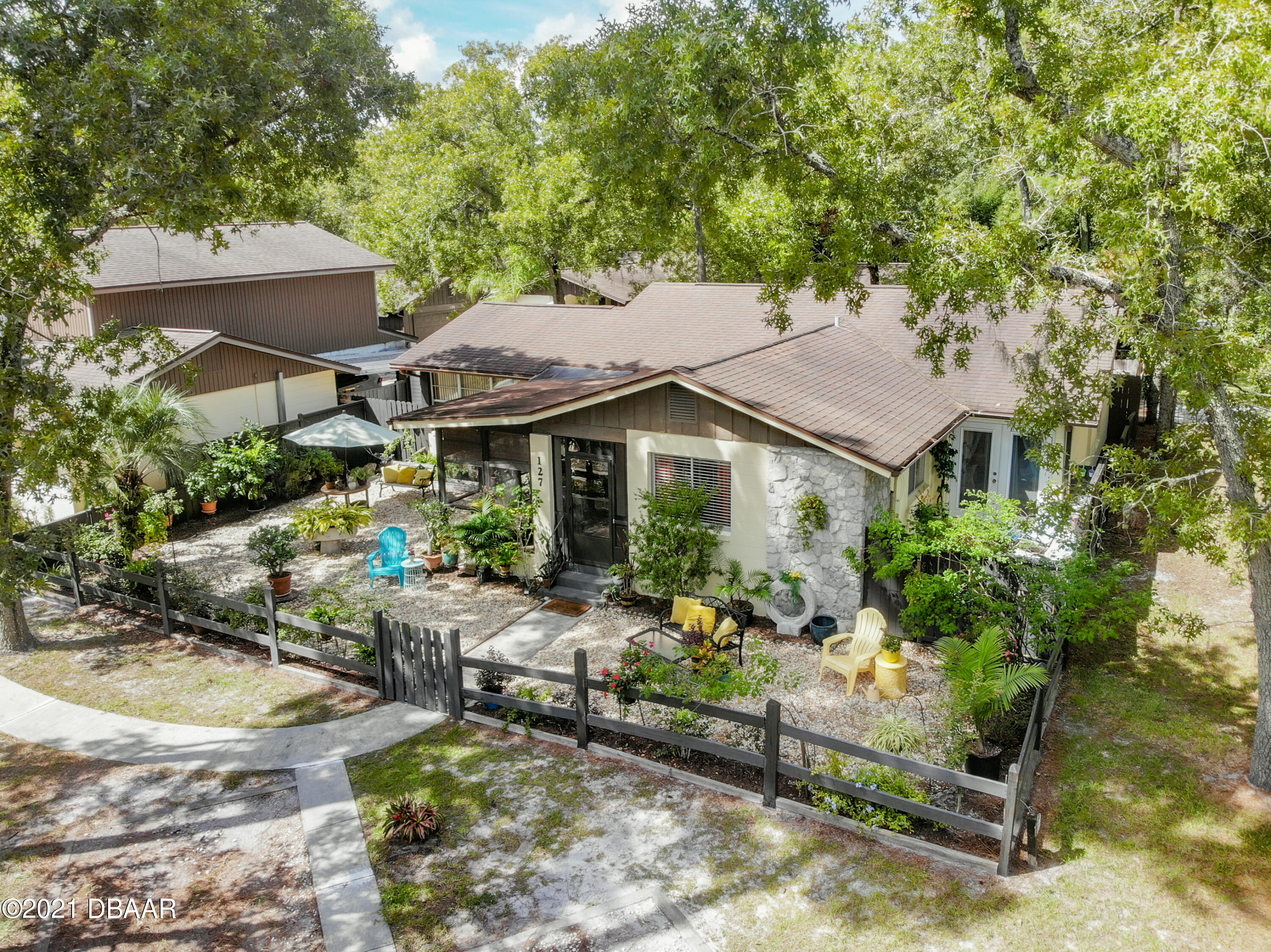 127 Cypress Pond Road Port Orange, FL 32128 - Photo 2 of 52 a aerial view of a house with swimming pool and sitting area