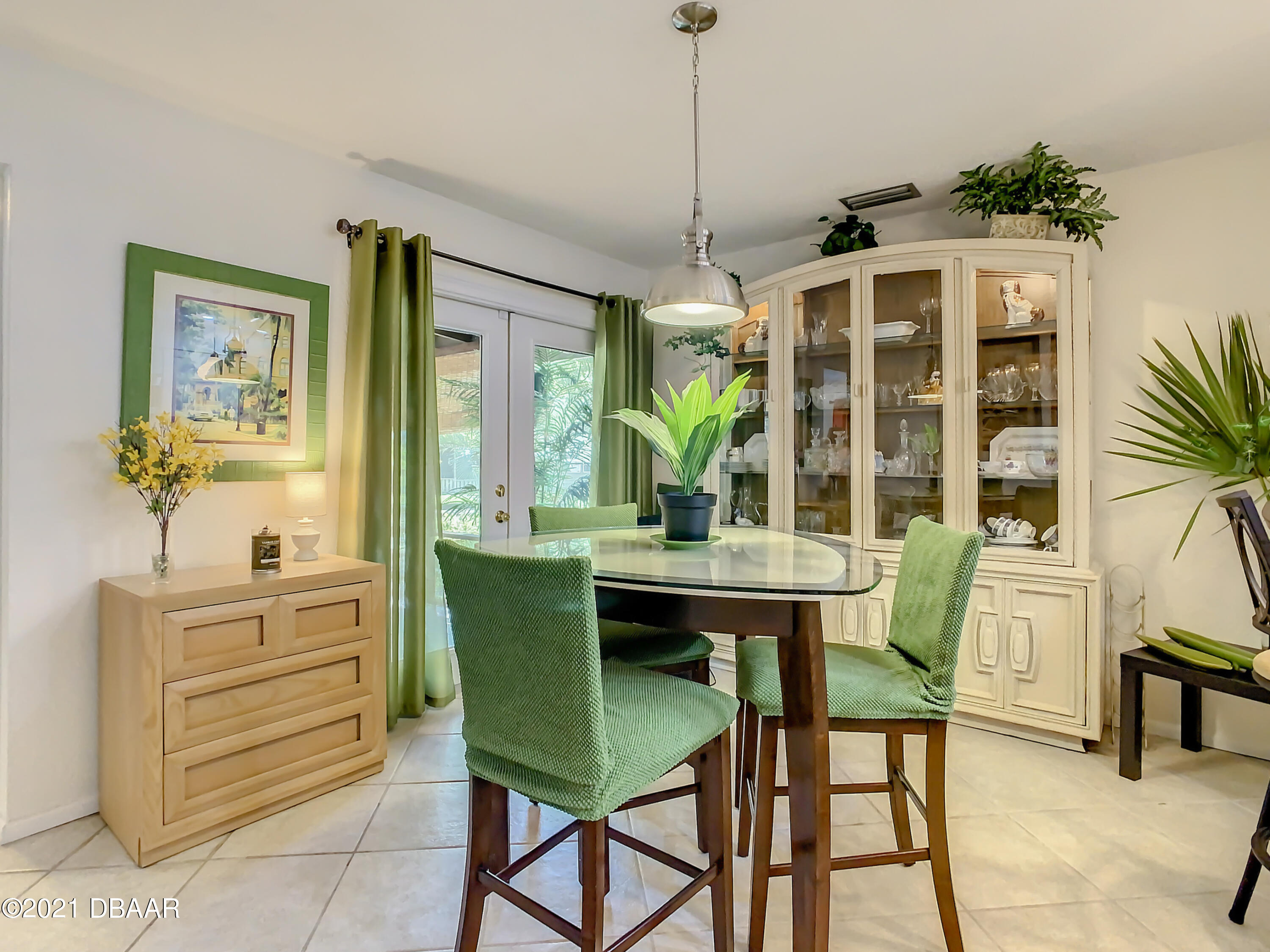 127 Cypress Pond Road Port Orange, FL 32128 - Photo 21 of 52 a view of a dining room with furniture window and outside view