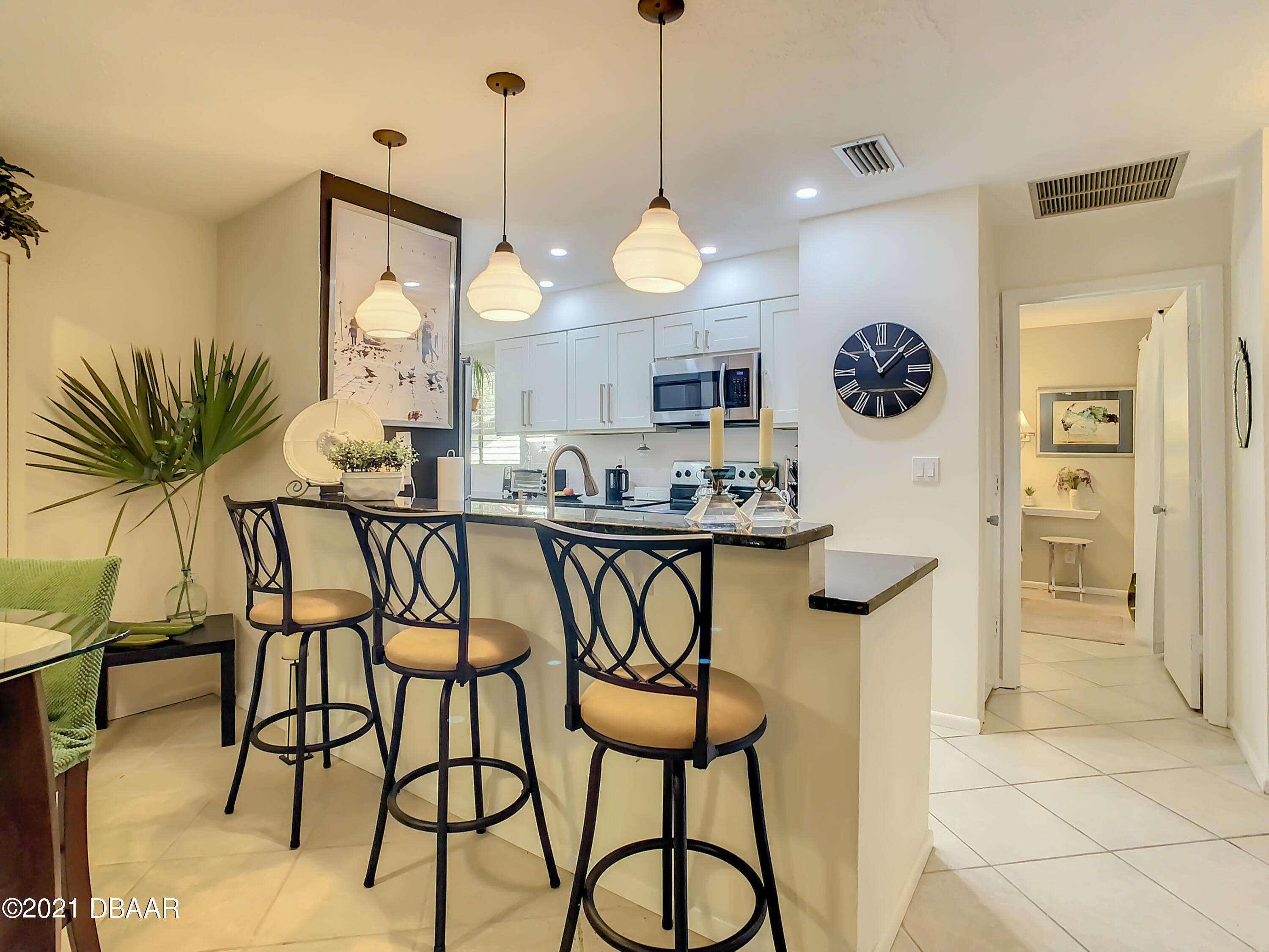 127 Cypress Pond Road Port Orange, FL 32128 - Photo 22 of 52 a kitchen with a table and chairs in it