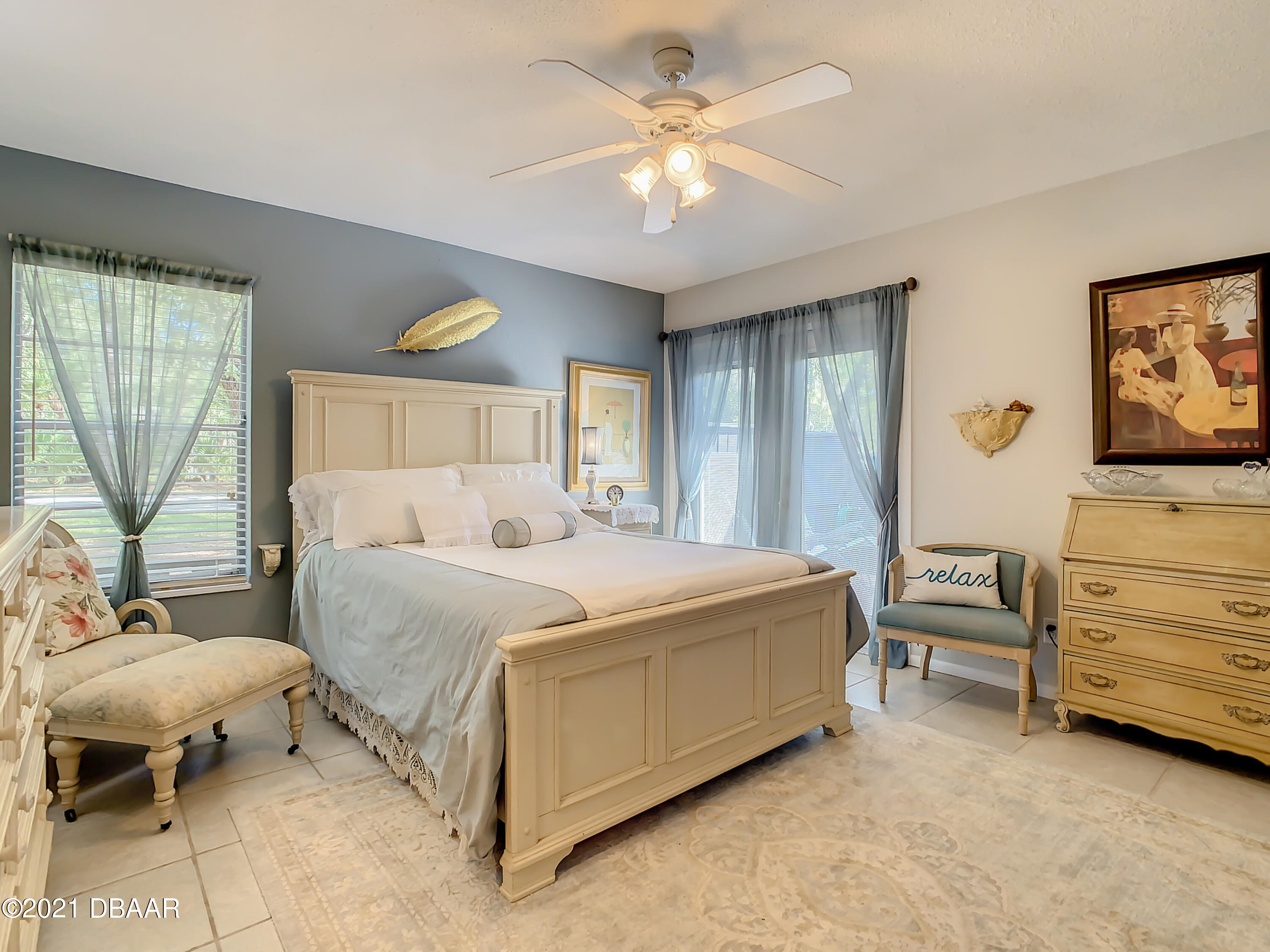 127 Cypress Pond Road Port Orange, FL 32128 - Photo 23 of 52 a spacious bedroom with a bed and a couch