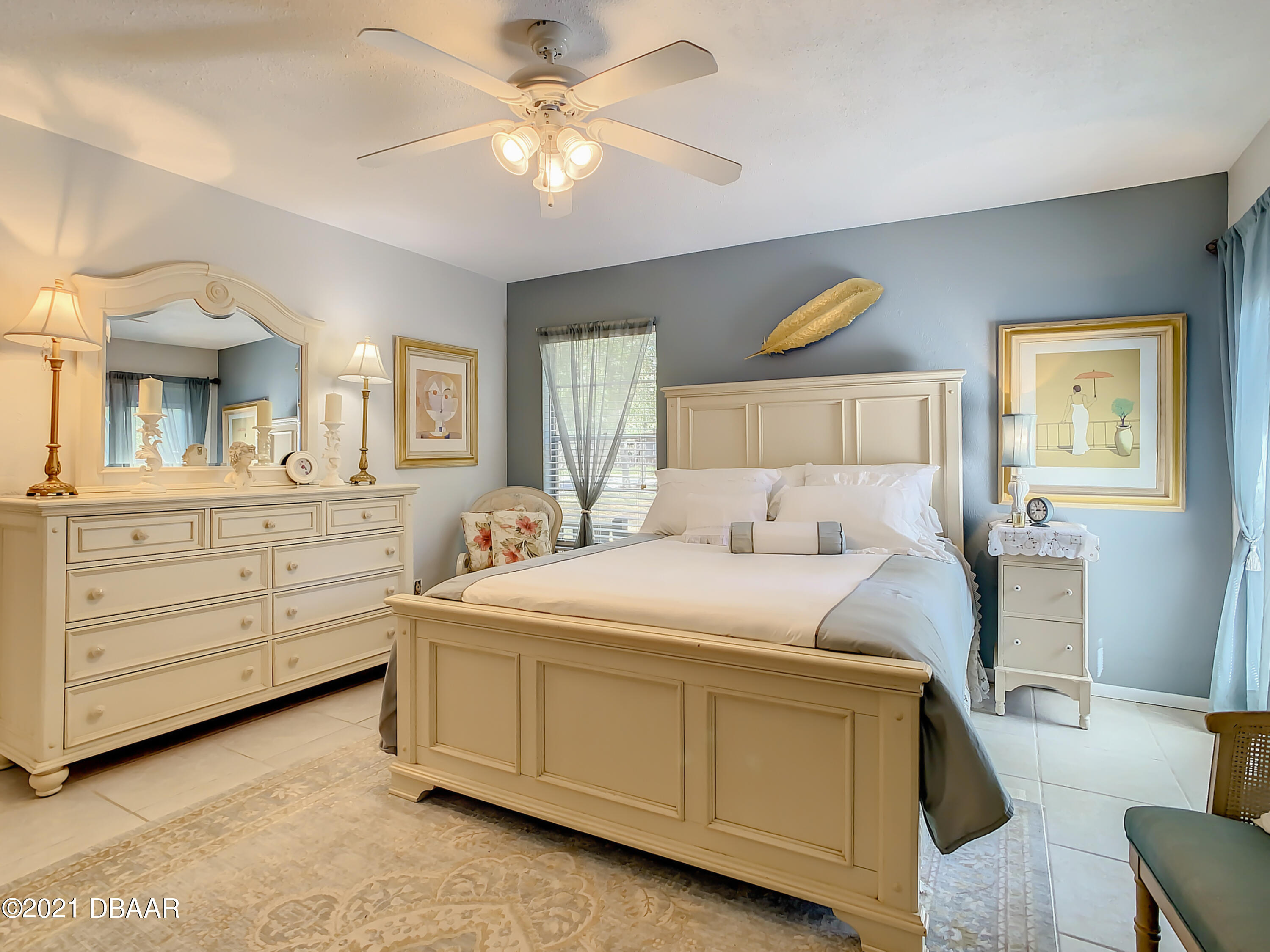 127 Cypress Pond Road Port Orange, FL 32128 - Photo 24 of 52 a bed room with a bed and a dresser
