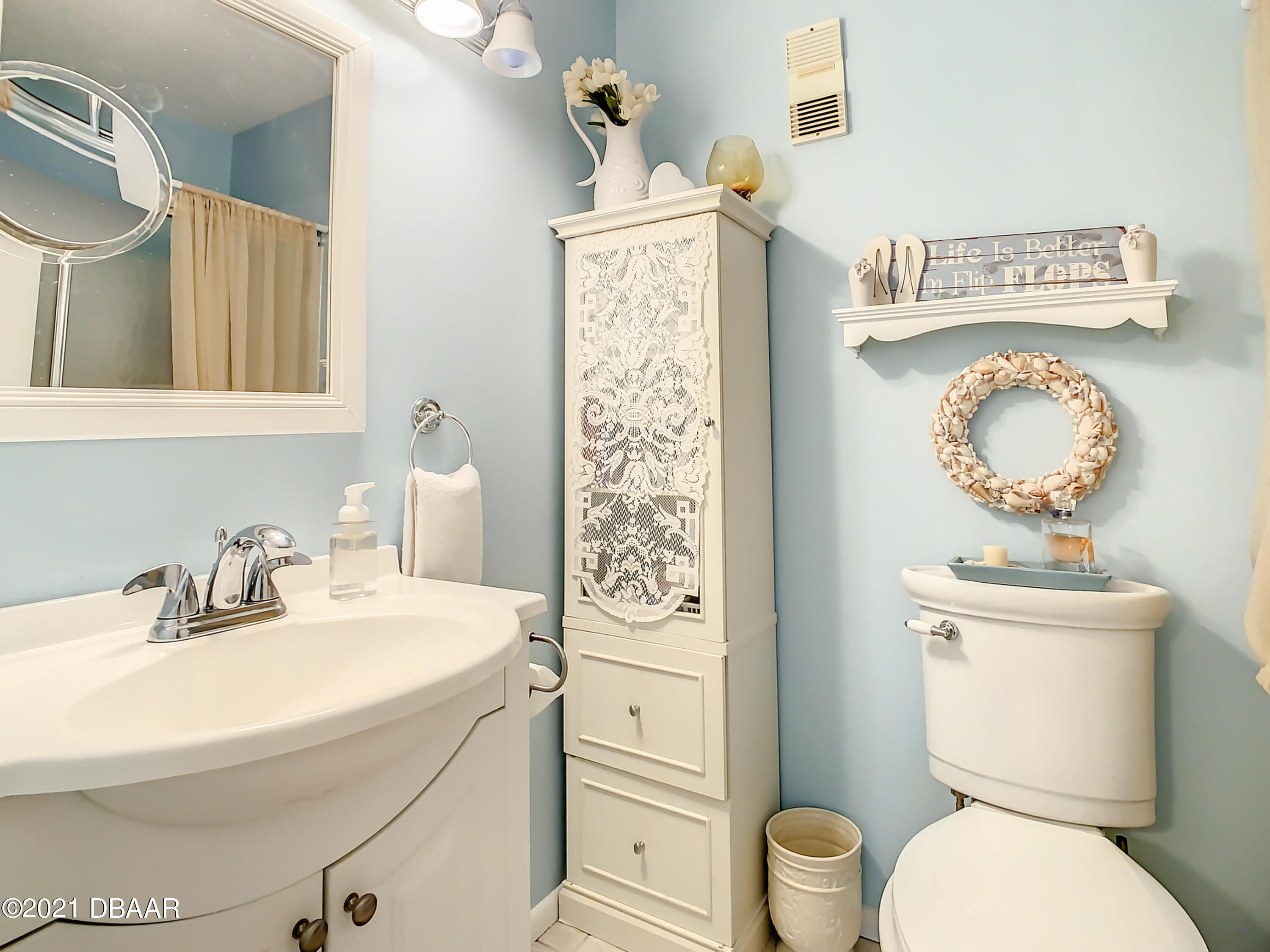 127 Cypress Pond Road Port Orange, FL 32128 - Photo 26 of 52 a bathroom with a toilet sink and mirror