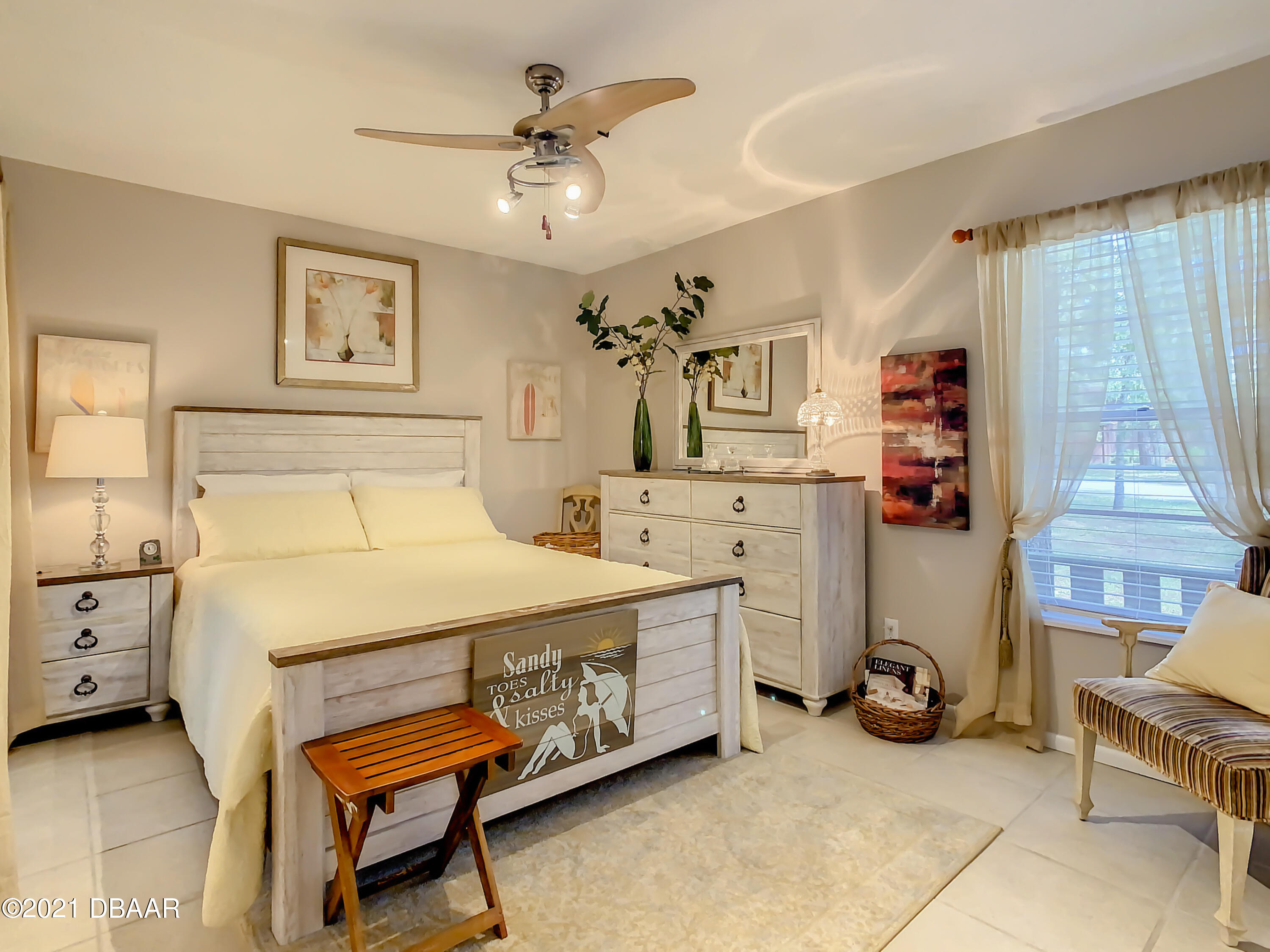 127 Cypress Pond Road Port Orange, FL 32128 - Photo 29 of 52 a spacious bedroom with a bed and a table in it