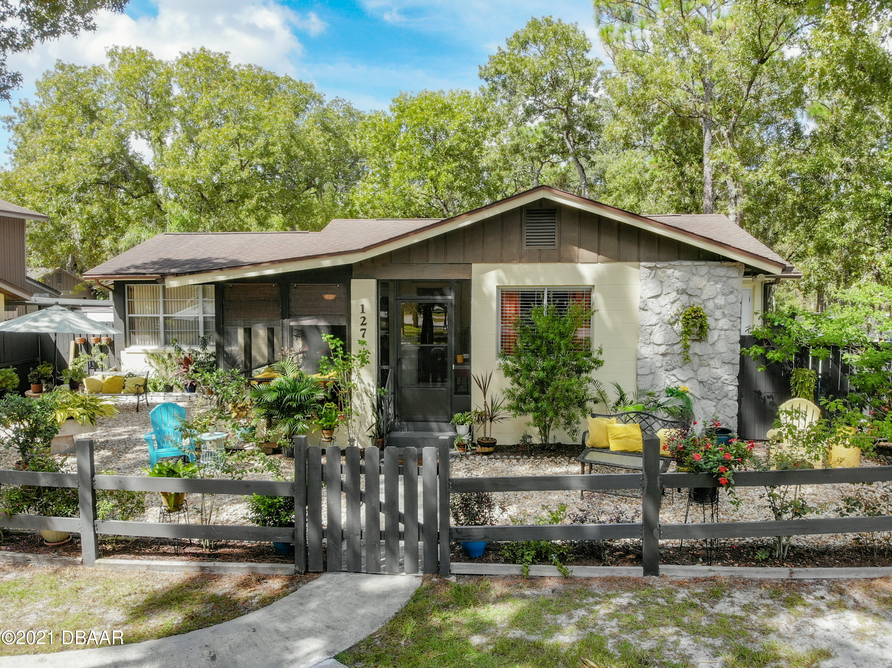 127 Cypress Pond Road Port Orange, FL 32128 - Photo 3 of 52 a front view of a house with porch
