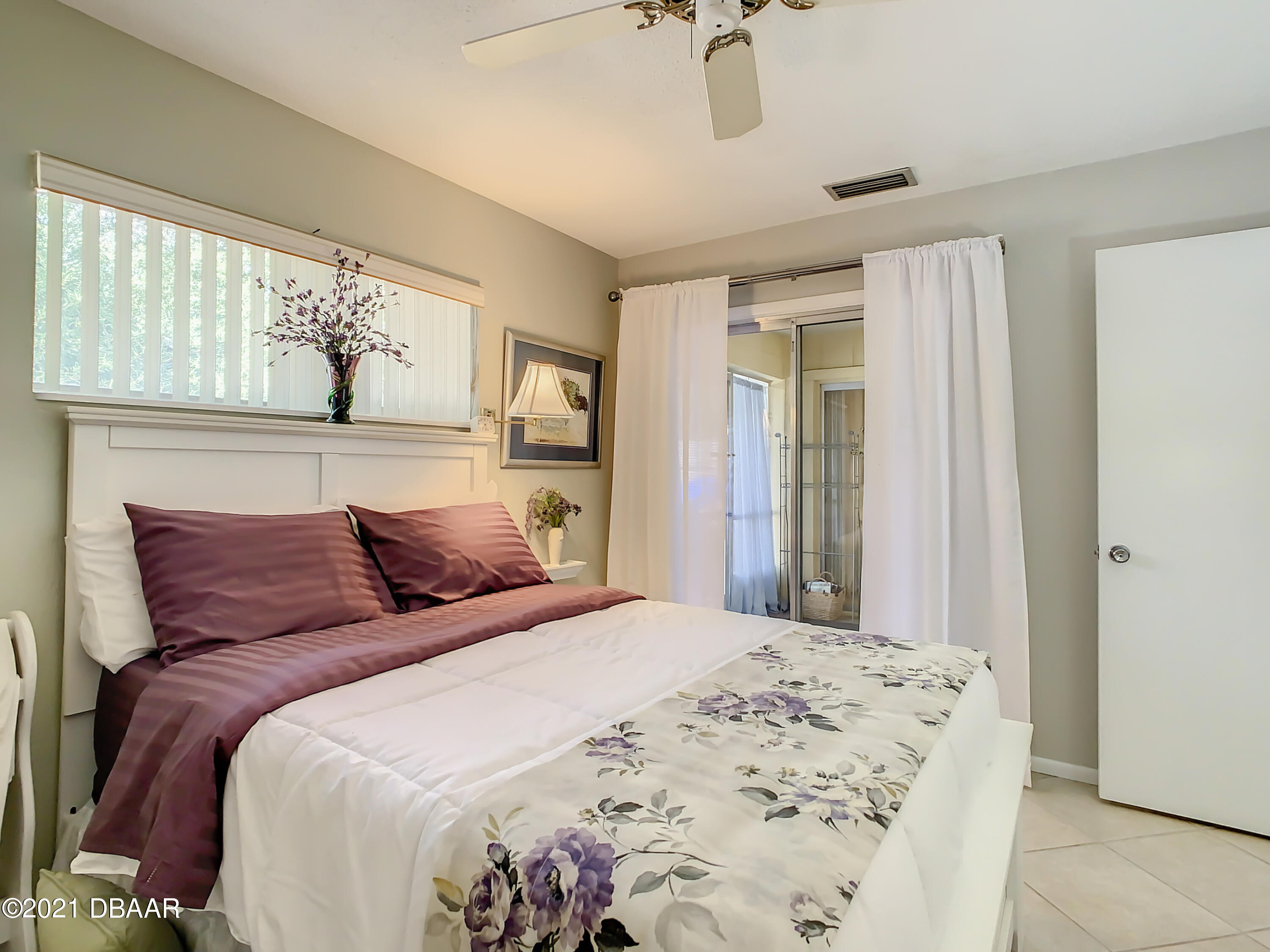 127 Cypress Pond Road Port Orange, FL 32128 - Photo 35 of 52 a bedroom with a large bed and a window