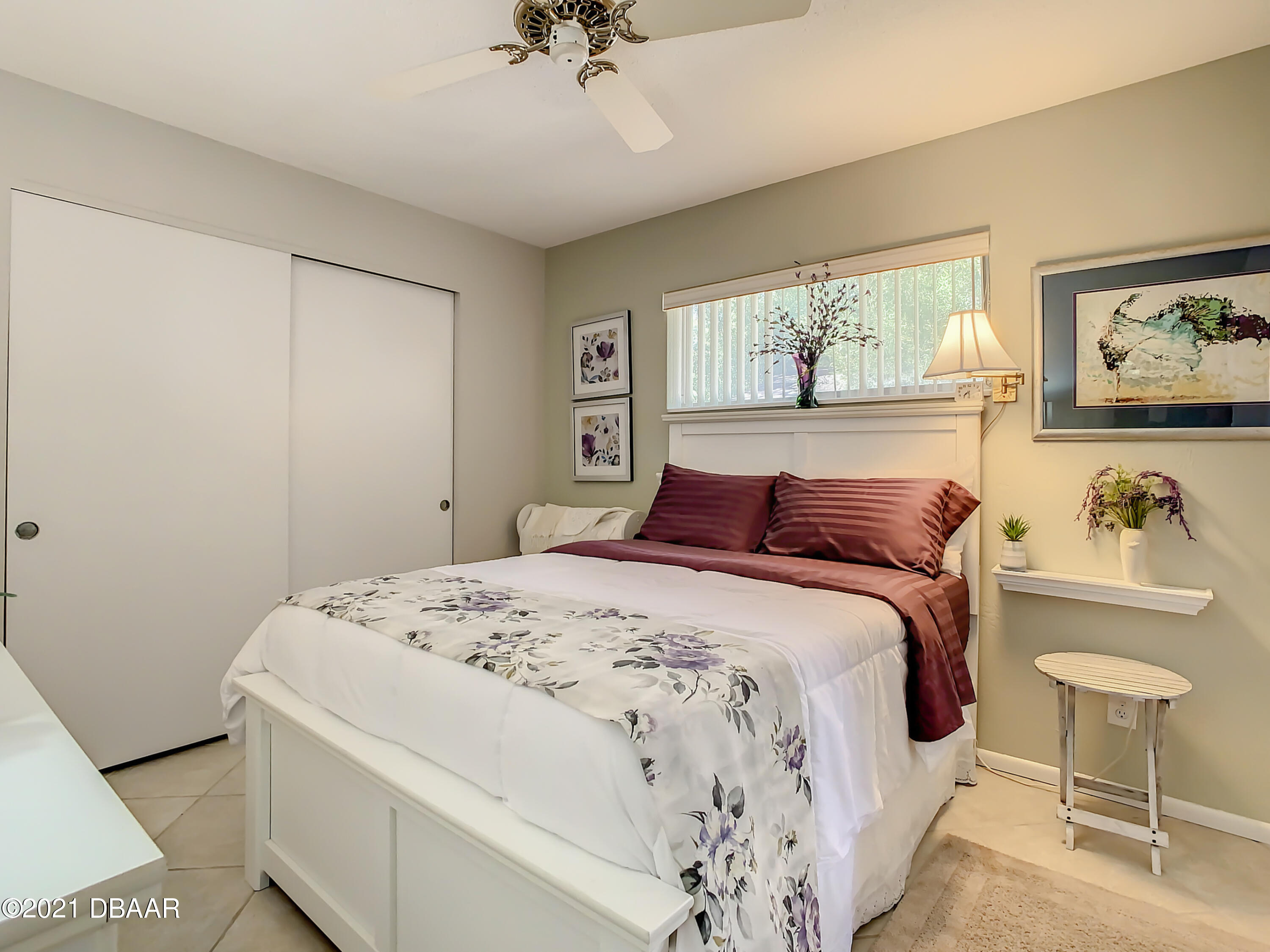 127 Cypress Pond Road Port Orange, FL 32128 - Photo 37 of 52 a bedroom with a bed and a chandelier