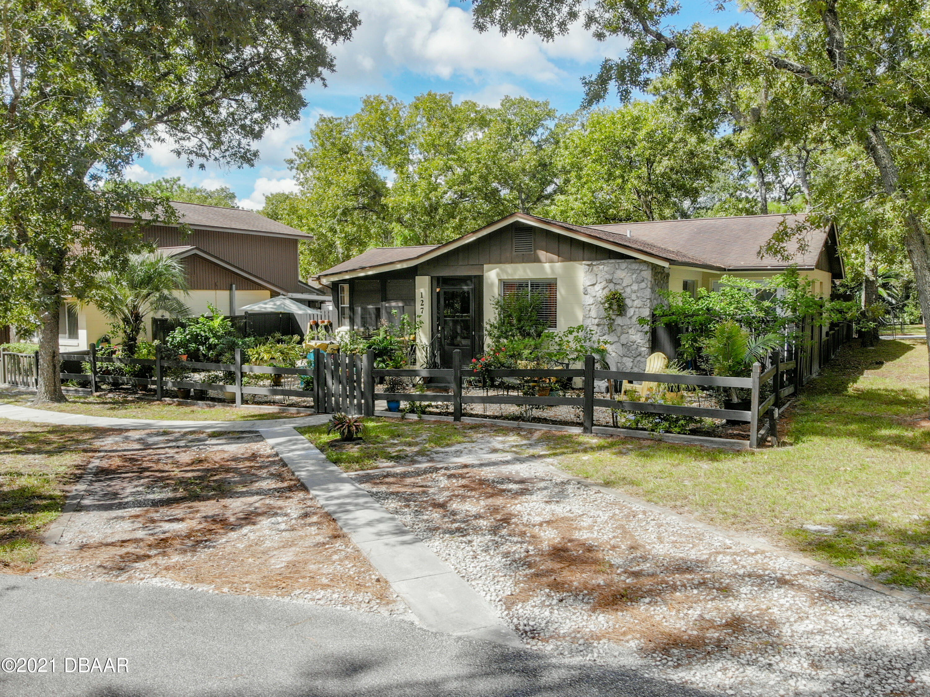 127 Cypress Pond Road Port Orange, FL 32128 - Photo 4 of 52 a view of a house with backyard porch and sitting area