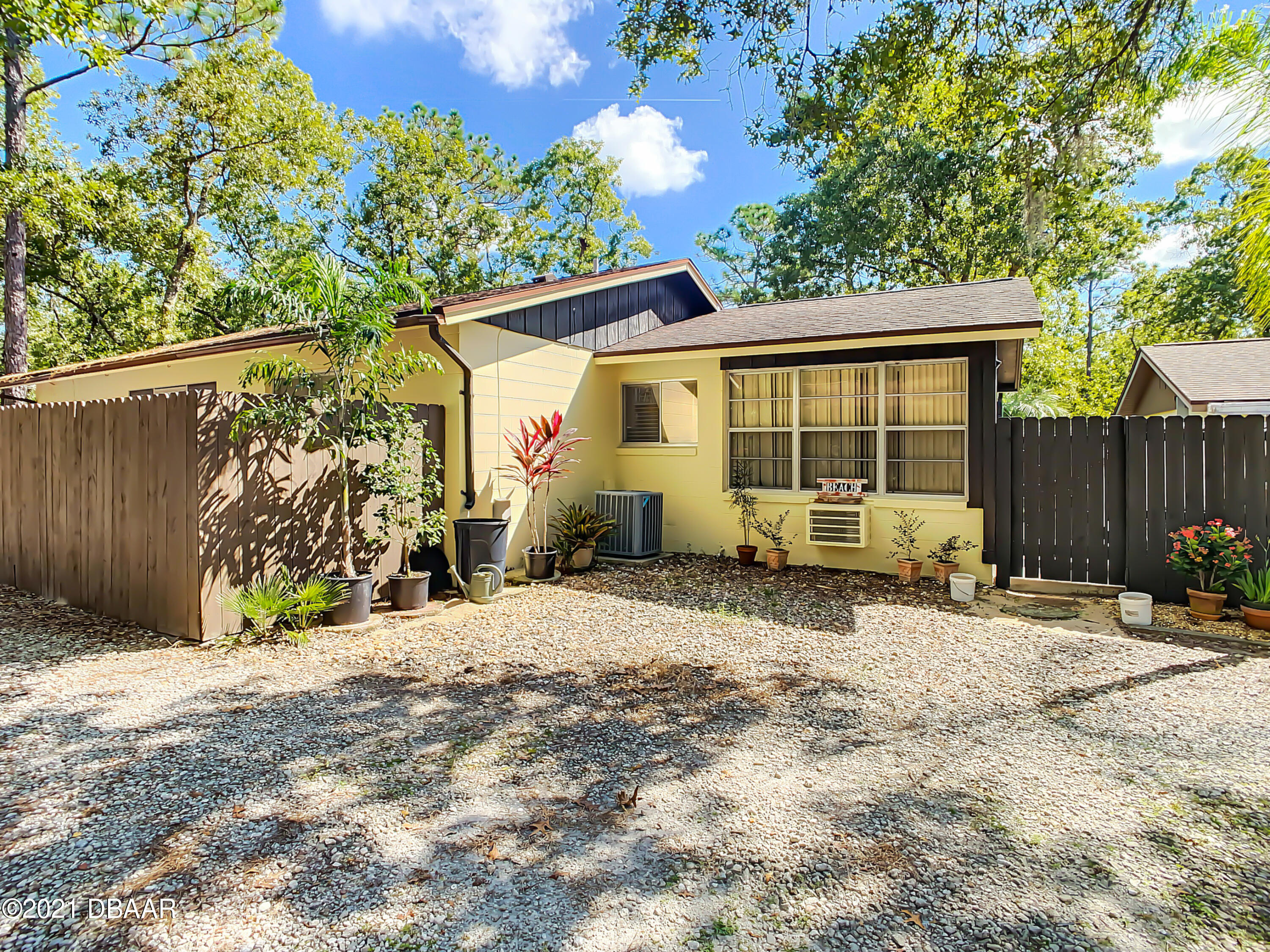 127 Cypress Pond Road Port Orange, FL 32128 - Photo 43 of 52 a view of a house with a patio