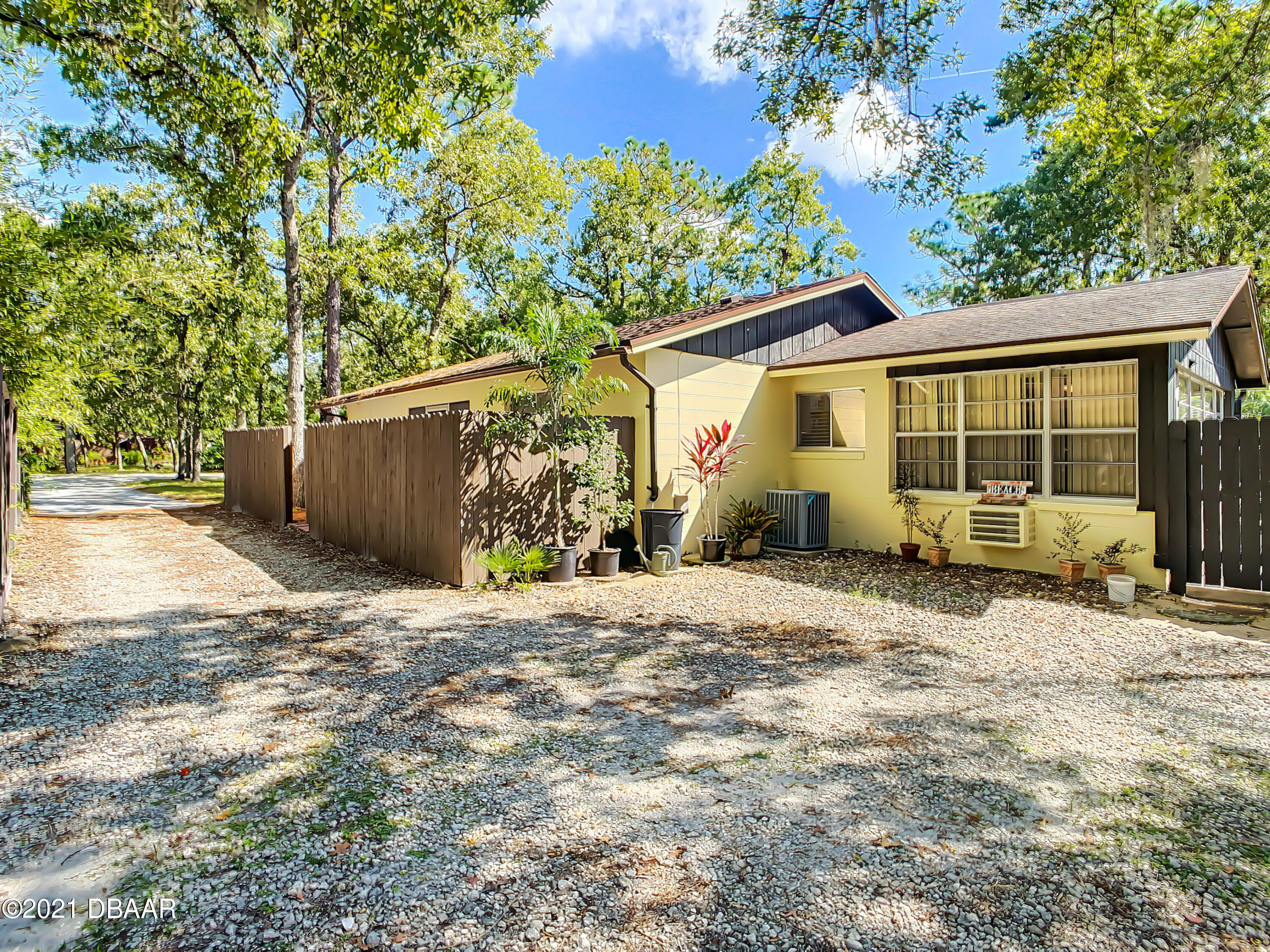 127 Cypress Pond Road Port Orange, FL 32128 - Photo 45 of 52 a view of a house with a backyard and a tree