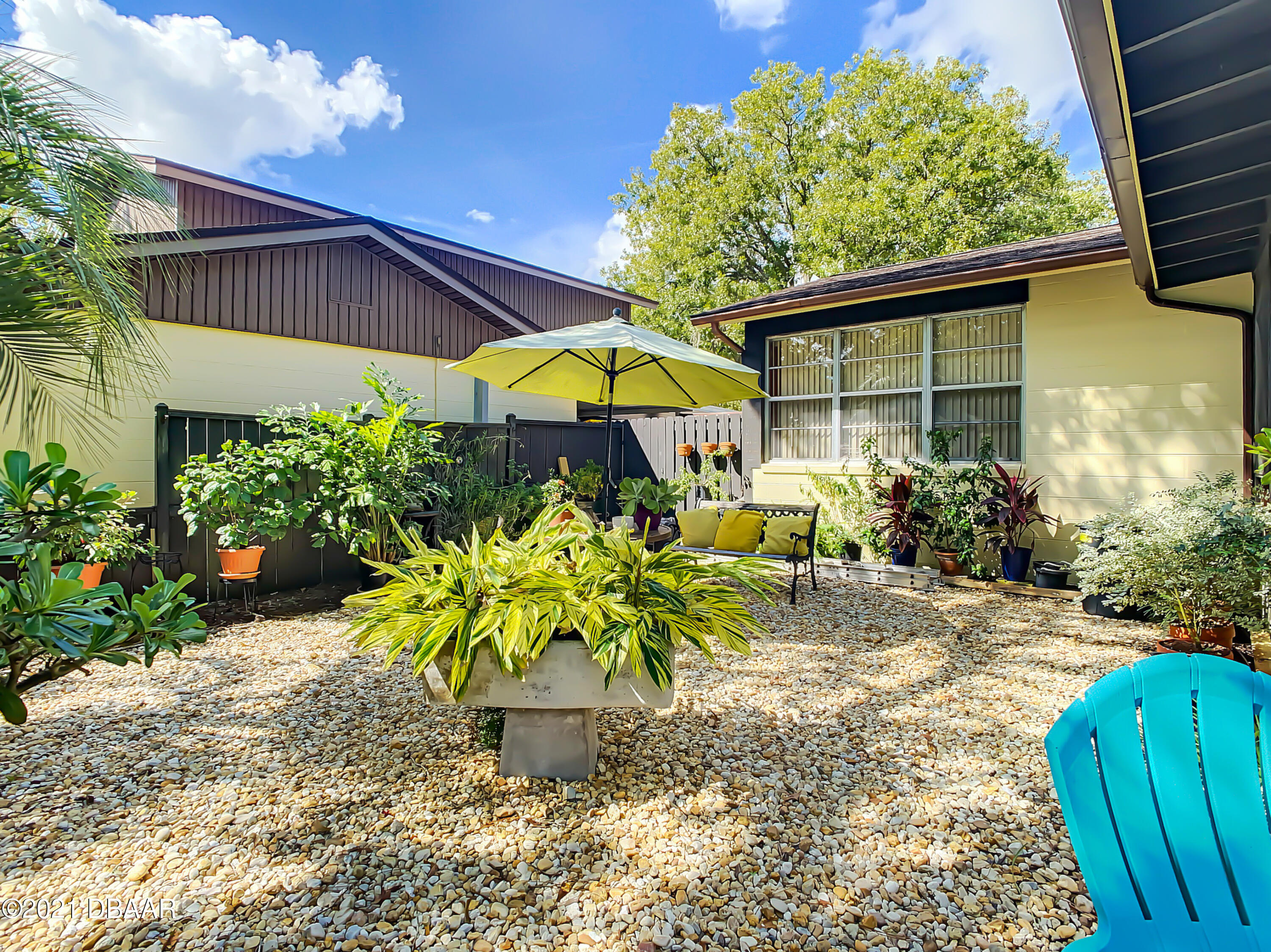 127 Cypress Pond Road Port Orange, FL 32128 - Photo 46 of 52 a view of a backyard with potted plants