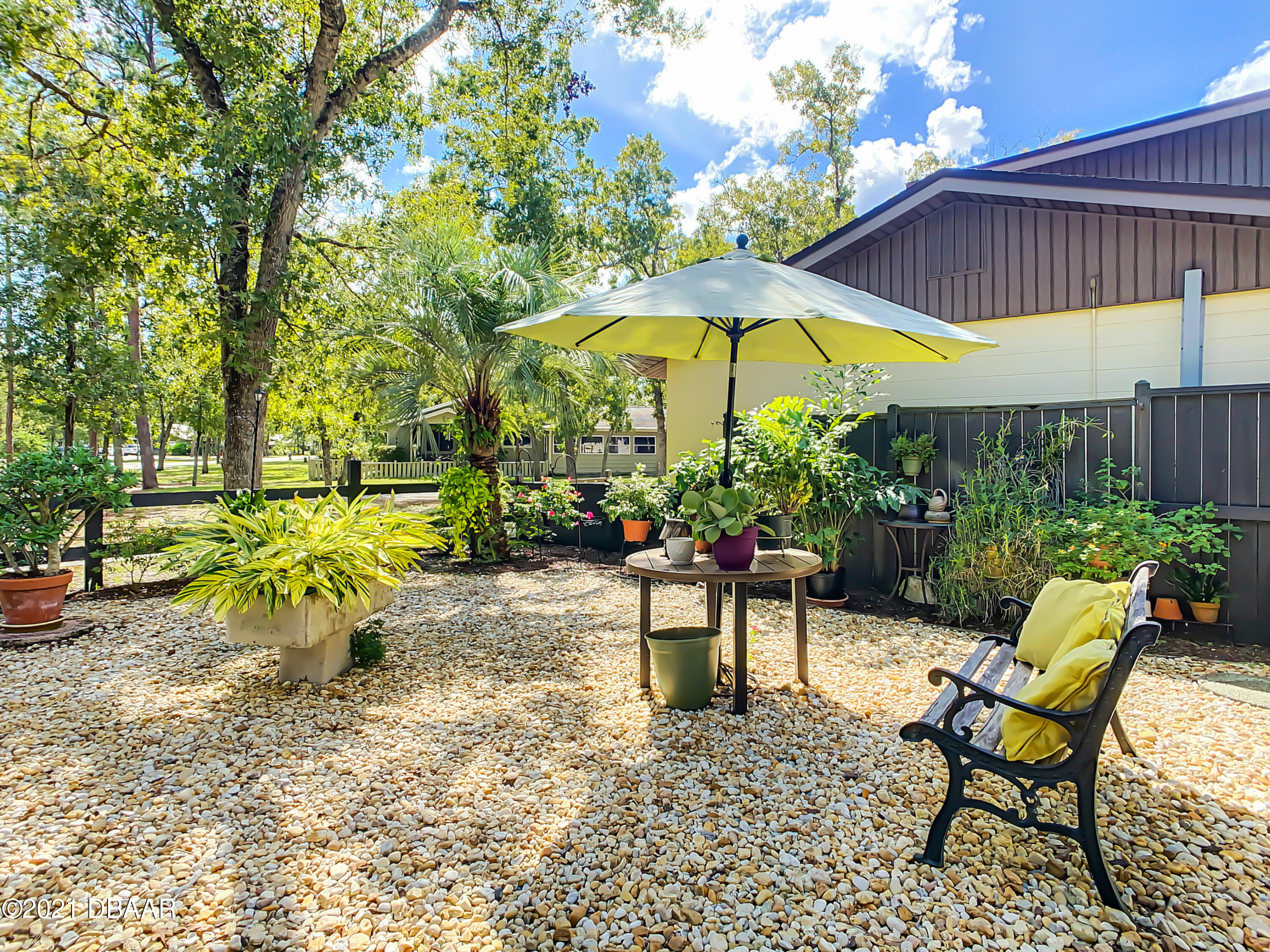 127 Cypress Pond Road Port Orange, FL 32128 - Photo 48 of 52 a view of a backyard with sitting area and furniture