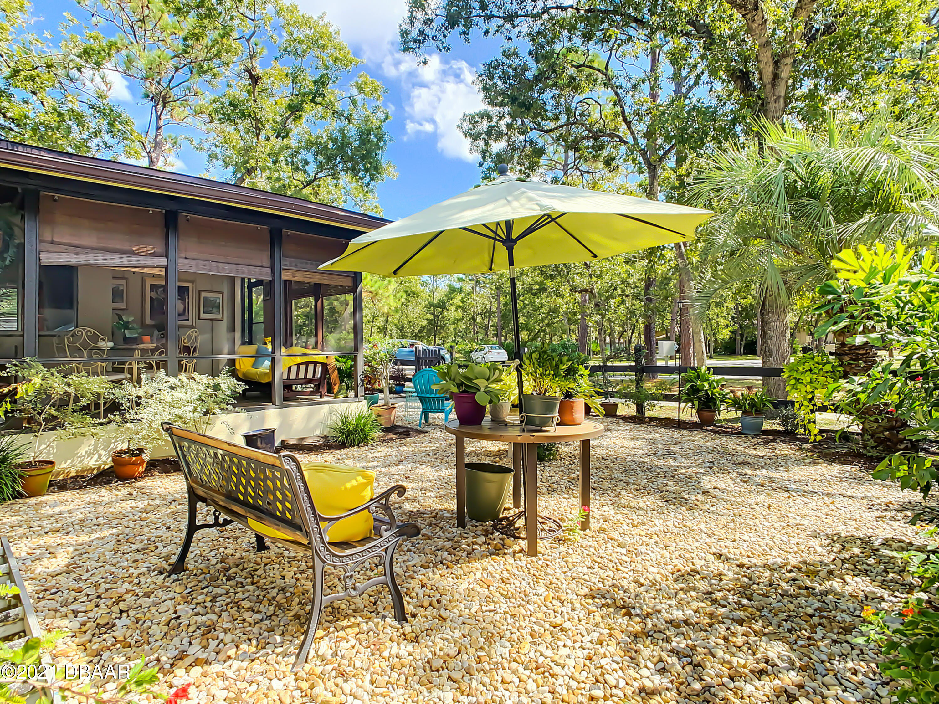 127 Cypress Pond Road Port Orange, FL 32128 - Photo 49 of 52 a view of a swimming pool with chairs in patio