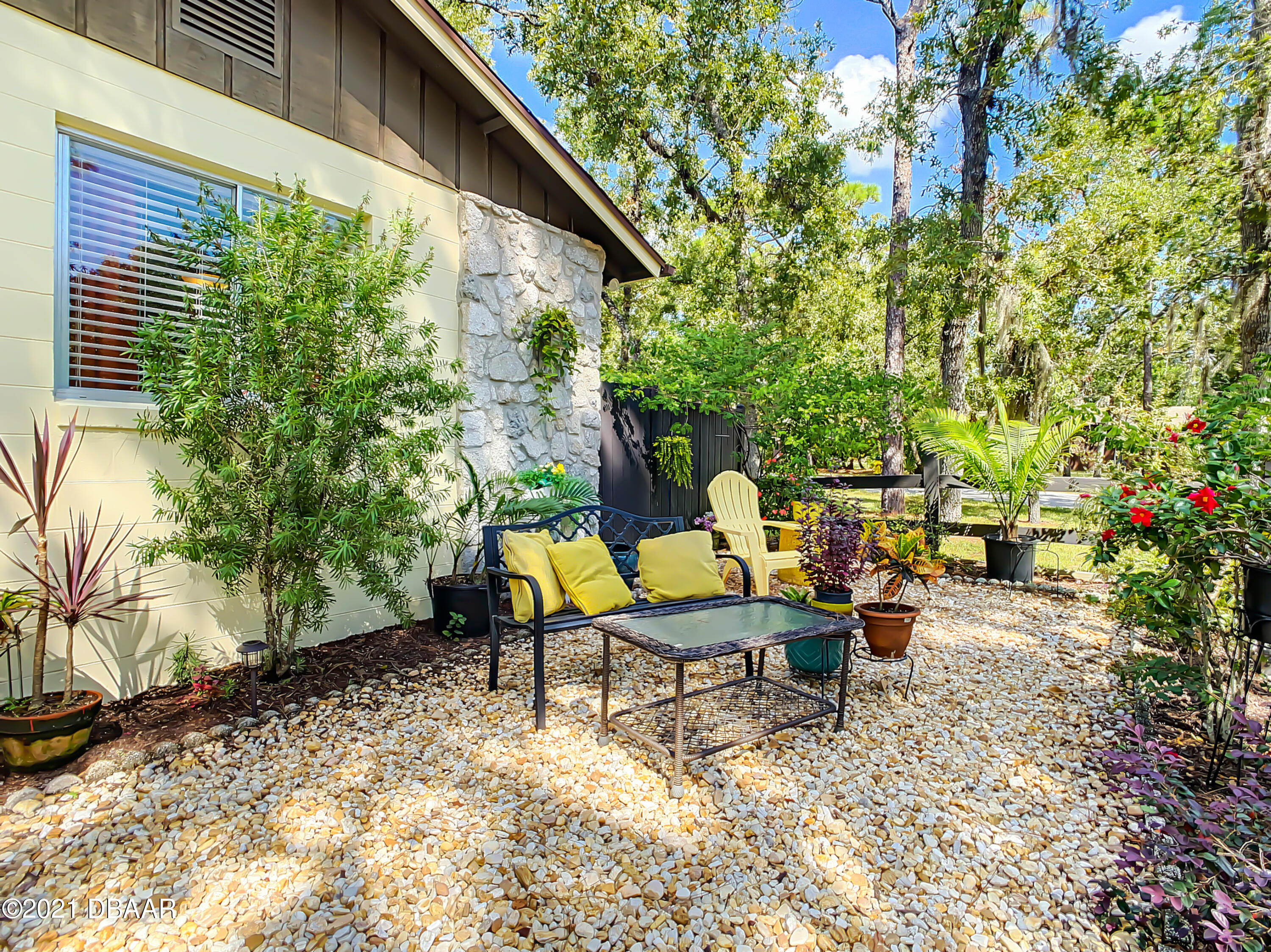 127 Cypress Pond Road Port Orange, FL 32128 - Photo 51 of 52 a backyard of a house with table and chairs