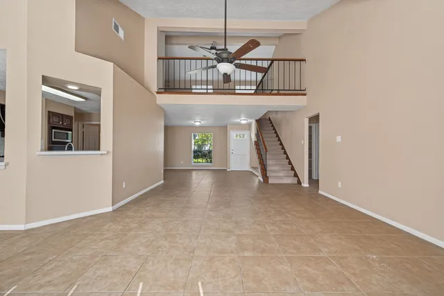a view of entryway and hall with a front door