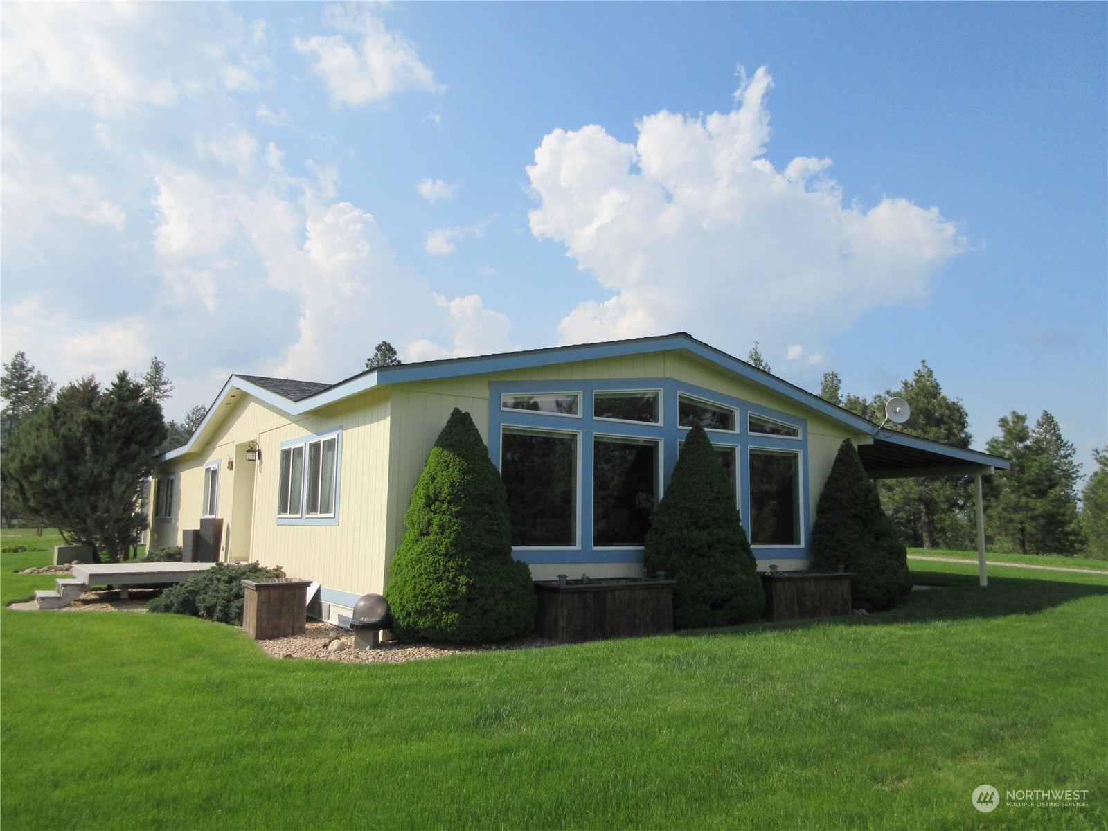 156 West Curlew Lake Road Republic, WA 99166 - Photo 1 of 36 a front view of house with yard and green space
