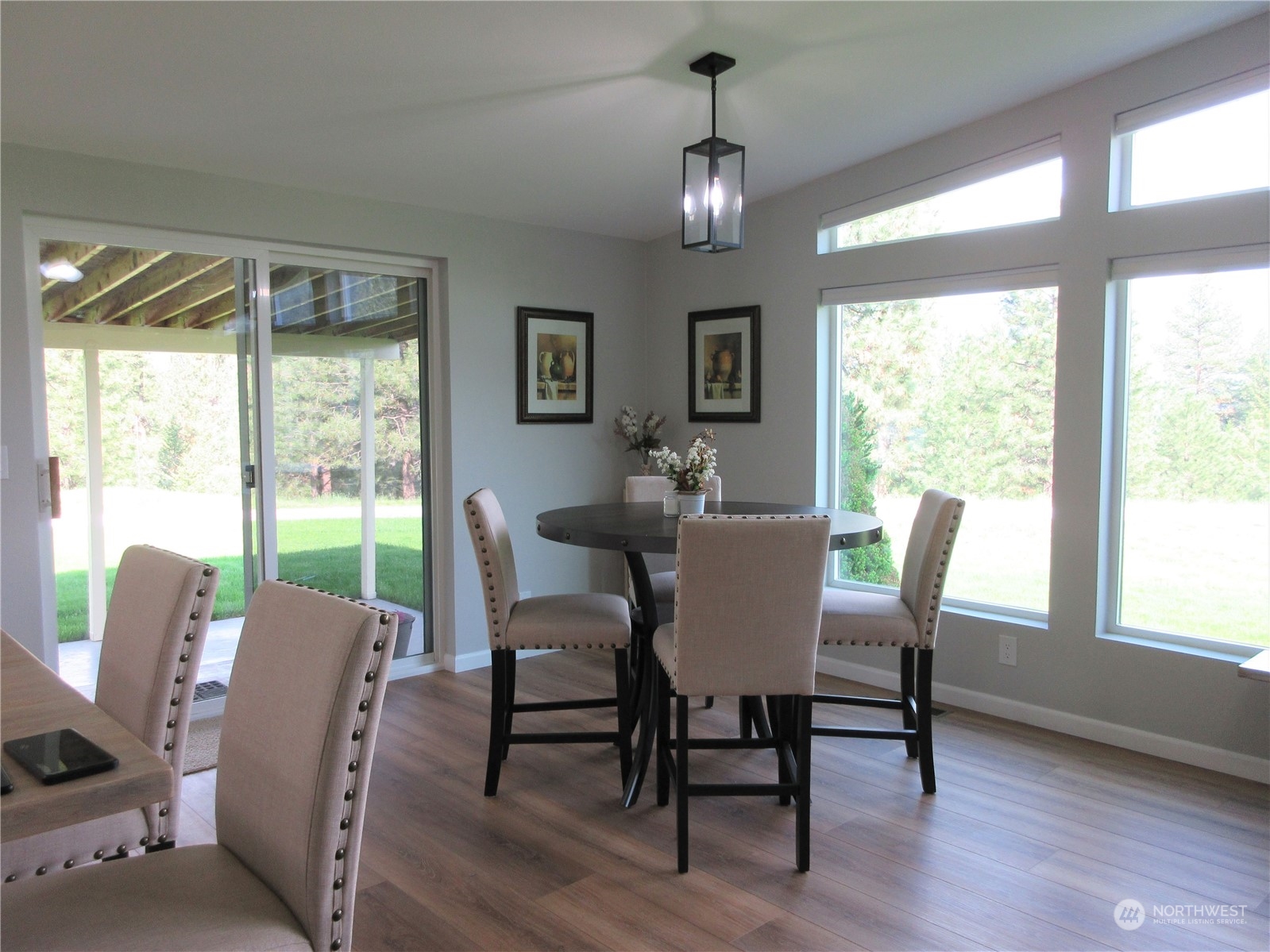156 West Curlew Lake Road Republic, WA 99166 - Photo 11 of 36 a view of a dining room with furniture window and wooden floor