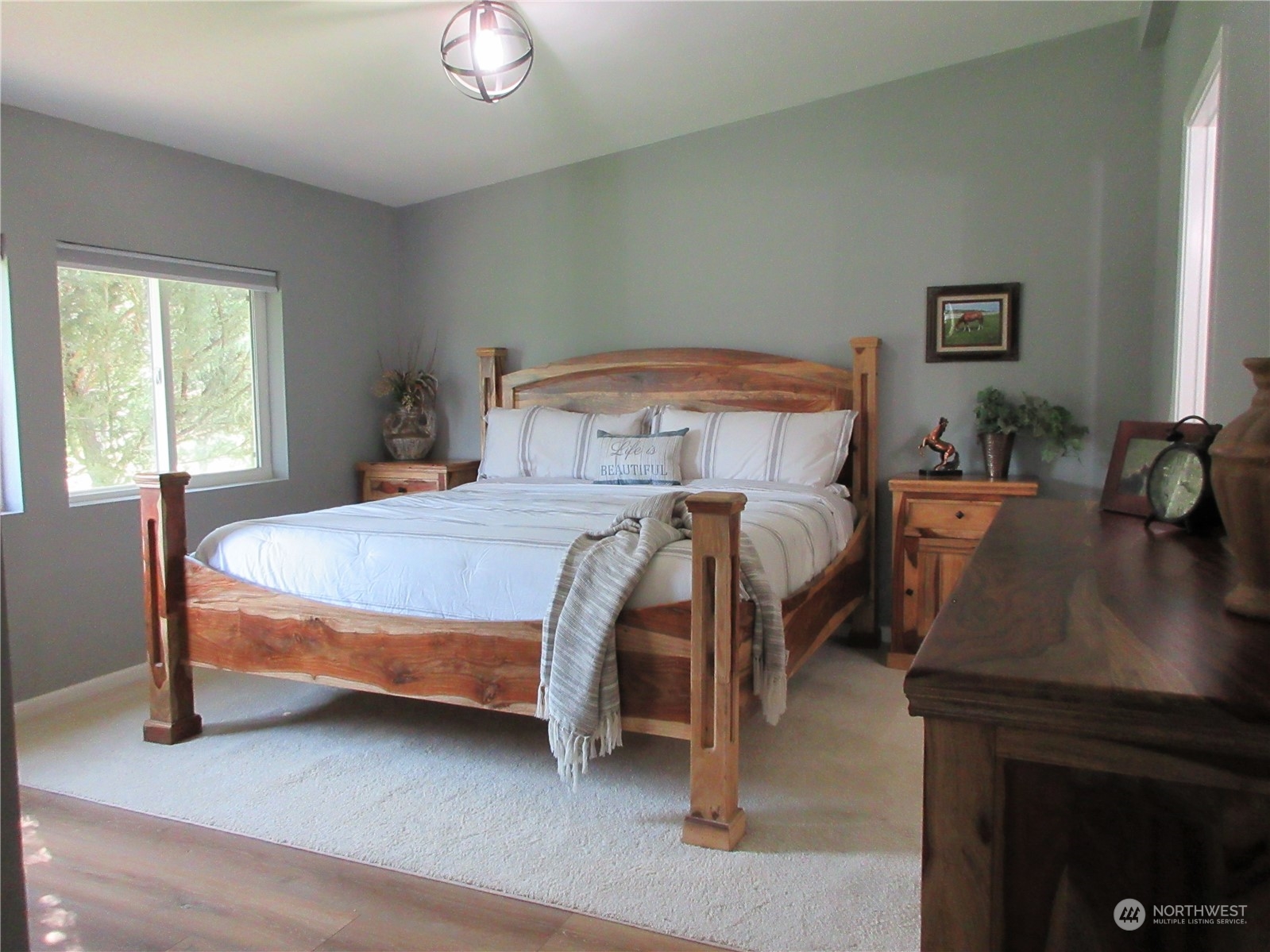 156 West Curlew Lake Road Republic, WA 99166 - Photo 12 of 36 a bedroom with a bed and a table in it