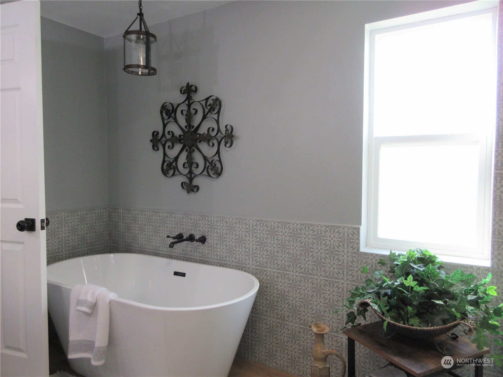 156 West Curlew Lake Road Republic, WA 99166 - Photo 16 of 36 a white bath tub sitting in a bathroom