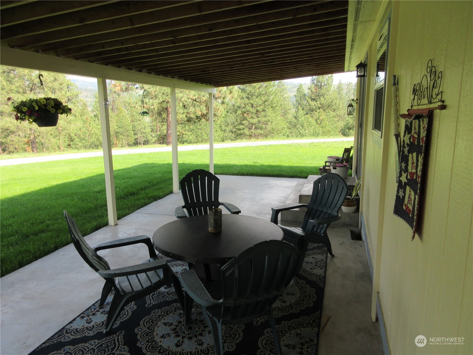 156 West Curlew Lake Road Republic, WA 99166 - Photo 21 of 36 a view of a porch with furniture and yard